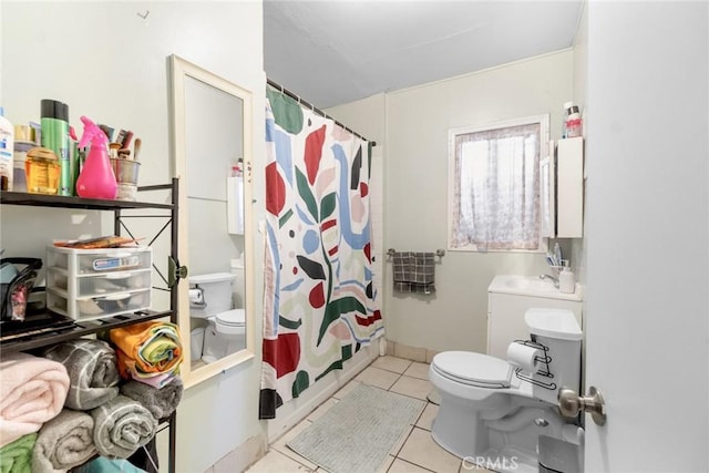151 E 105th St, Los Angeles, CA 90003 - bathroom featuring toilet, tile patterned flooring, a shower with curtain, and a sink