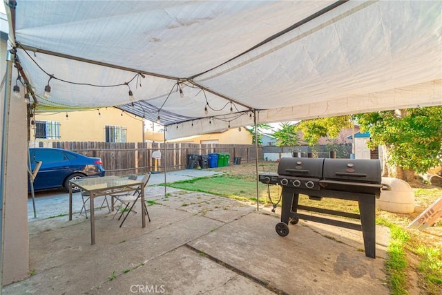 151 E 105th St, Los Angeles, CA 90003 - fenced backyard featuring a patio area, outdoor dining area, and area for grilling