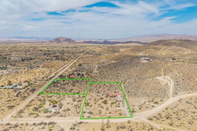 5115 Warren Vista Ave, Yucca Valley, CA 92284 - view of rural area featuring a desert landscape, a mountainous background, and property boundaries highlighted