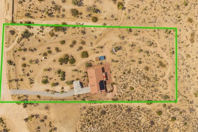 5115 Warren Vista Ave, Yucca Valley, CA 92284 - aerial overview of property's location with a desert landscape and property boundaries highlighted