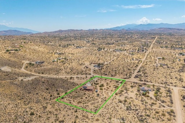 5115 Warren Vista Ave, Yucca Valley, CA 92284 - overview of rural landscape featuring a desert landscape, mountains, and property parcel outlined