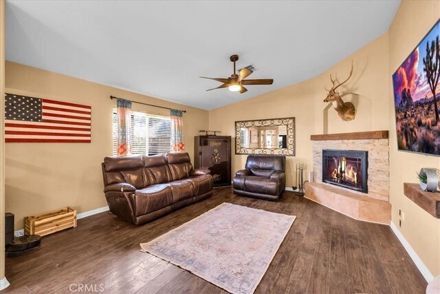 5115 Warren Vista Ave, Yucca Valley, CA 92284 - living area featuring wood finished floors, ceiling fan, a fireplace, baseboards, and vaulted ceiling