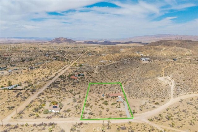 5115 Warren Vista Ave, Yucca Valley, CA 92284 - overview of rural landscape with a desert landscape, mountains, and property parcel outlined
