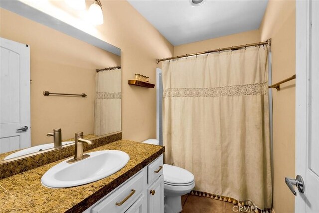 5115 Warren Vista Ave, Yucca Valley, CA 92284 - bathroom featuring vanity, toilet, a shower with curtain, and tile patterned floors