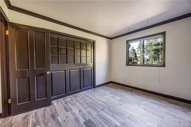 968 Lausanne Dr, Crestline, CA 92325 - unfurnished bedroom featuring light wood-style floors, baseboards, and ornamental molding