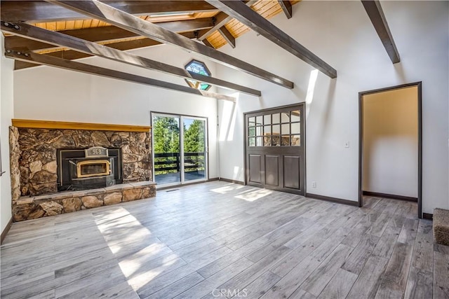 968 Lausanne Dr, Crestline, CA 92325 - unfurnished living room with beamed ceiling, wood finished floors, baseboards, and high vaulted ceiling
