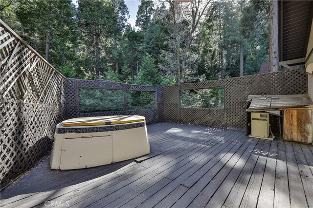 968 Lausanne Dr, Crestline, CA 92325 - deck with a hot tub and view of scattered trees