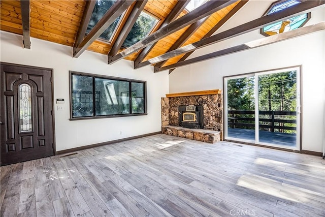 968 Lausanne Dr, Crestline, CA 92325 - unfurnished living room with baseboards, wood finished floors, wooden ceiling with exposed beams, a skylight, and high vaulted ceiling