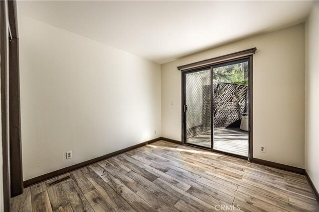 968 Lausanne Dr, Crestline, CA 92325 - unfurnished room featuring wood finished floors and baseboards