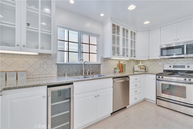 1713 Carlson, Redondo Beach, CA 90278 - kitchen with appliances with stainless steel finishes, beverage cooler, white cabinetry, and recessed lighting