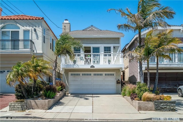 1713 Carlson, Redondo Beach, CA 90278 - view of front of property with an attached garage, concrete driveway, a chimney, and stucco siding