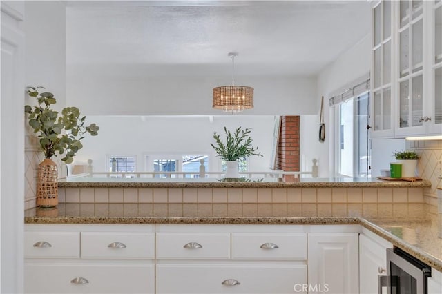 1713 Carlson, Redondo Beach, CA 90278 - kitchen featuring beverage cooler, backsplash, glass insert cabinets, a chandelier, and white cabinets