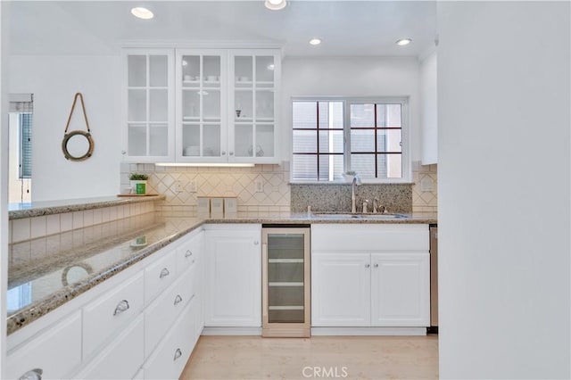 1713 Carlson, Redondo Beach, CA 90278 - kitchen with wine cooler, decorative backsplash, glass insert cabinets, and recessed lighting