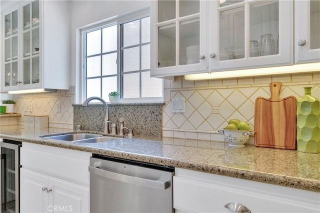 1713 Carlson, Redondo Beach, CA 90278 - kitchen with stainless steel dishwasher, beverage cooler, white cabinets, light stone counters, and backsplash