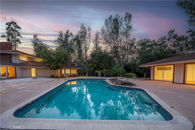 20827 E Mesarica Rd, Covina, CA 91724 - pool at dusk with a patio area and an outdoor pool