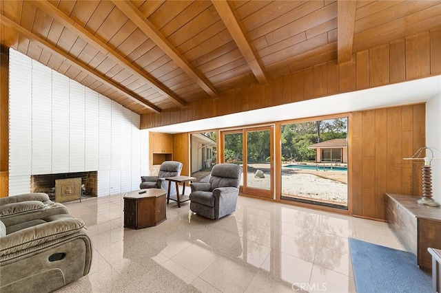 20827 E Mesarica Rd, Covina, CA 91724 - living area with wooden ceiling with exposed beams, wooden walls, a brick fireplace, and high vaulted ceiling