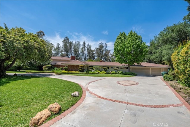 20827 E Mesarica Rd, Covina, CA 91724 - ranch-style home with curved driveway, a front lawn, and a chimney
