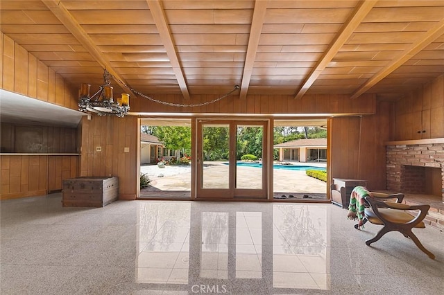 20827 E Mesarica Rd, Covina, CA 91724 - entryway with wood walls, wood ceiling, and a chandelier