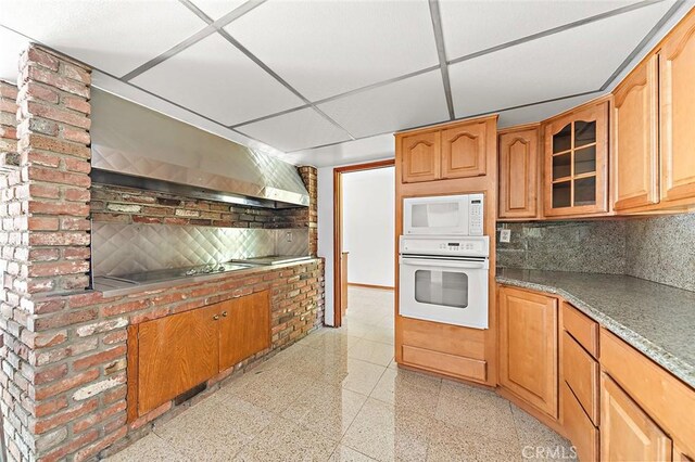 20827 E Mesarica Rd, Covina, CA 91724 - kitchen featuring white appliances, backsplash, glass insert cabinets, and wall chimney exhaust hood