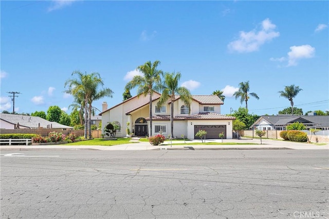 1048 Gladstone St, La Verne, CA 91750 - view of front of house with driveway, a tiled roof, and stucco siding