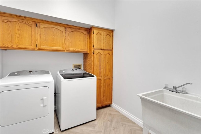 1048 Gladstone St, La Verne, CA 91750 - washroom featuring washing machine and dryer, cabinet space, and baseboards