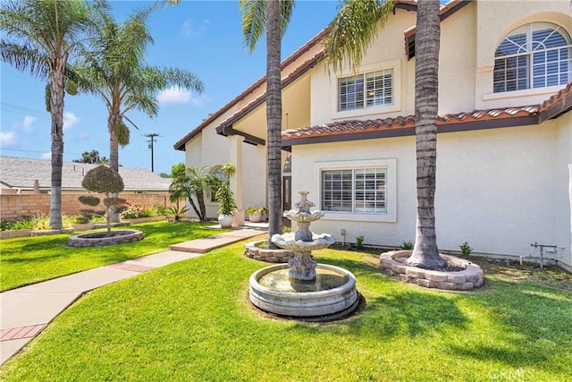 1048 Gladstone St, La Verne, CA 91750 - view of front of property with stucco siding, a front lawn, and a tiled roof