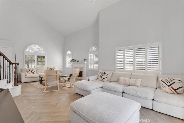 1048 Gladstone St, La Verne, CA 91750 - living room featuring high vaulted ceiling, stairs, and a fireplace
