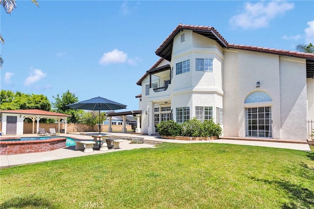 1048 Gladstone St, La Verne, CA 91750 - back of property with a hot tub, a tiled roof, stucco siding, a gazebo, and a patio