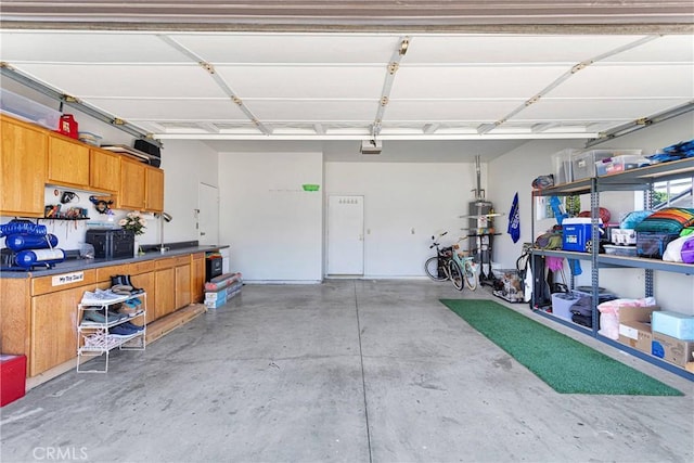 1048 Gladstone St, La Verne, CA 91750 - garage with strapped water heater and a garage door opener