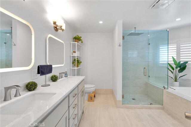 1048 Gladstone St, La Verne, CA 91750 - full bathroom featuring a shower stall, double vanity, a garden tub, tile patterned floors, and toilet