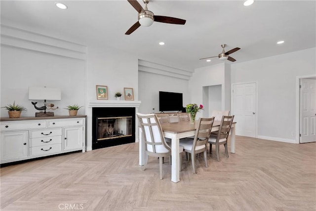 1048 Gladstone St, La Verne, CA 91750 - dining space featuring ceiling fan, a glass covered fireplace, recessed lighting, and baseboards