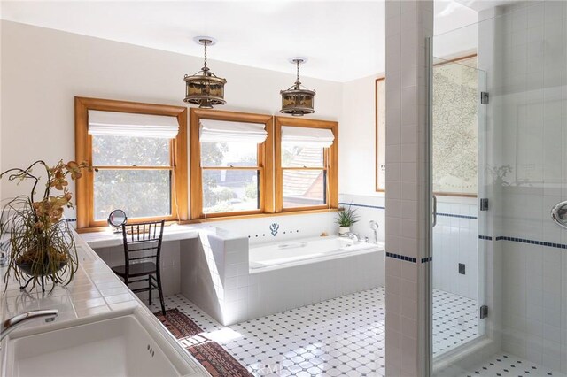 11 La Linda Dr, Long Beach, CA 90807 - bathroom with healthy amount of natural light, a stall shower, a bath, and a sink