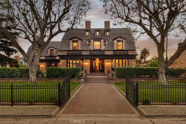 11 La Linda Dr, Long Beach, CA 90807 - view of front of house featuring brick siding, a balcony, a gate, and a chimney