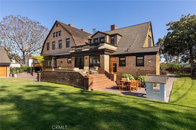 11 La Linda Dr, Long Beach, CA 90807 - back of house featuring a balcony, a patio area, a lawn, and a chimney