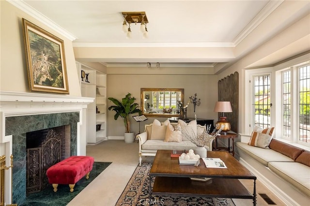 11 La Linda Dr, Long Beach, CA 90807 - living room featuring carpet flooring, a premium fireplace, ornamental molding, built in features, and baseboards