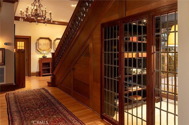 11 La Linda Dr, Long Beach, CA 90807 - wine area featuring wood finished floors and a chandelier
