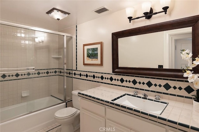 11 La Linda Dr, Long Beach, CA 90807 - full bath featuring vanity, toilet, enclosed tub / shower combo, tile walls, and tile patterned floors