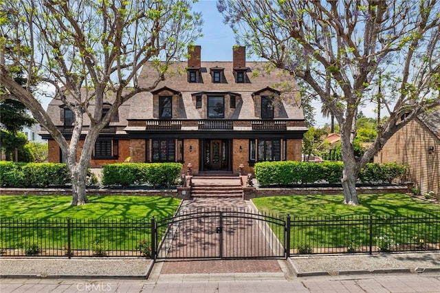 11 La Linda Dr, Long Beach, CA 90807 - view of front of property featuring brick siding, a gate, a chimney, and a balcony