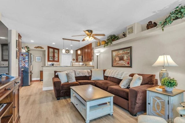 1873 Key Largo Rd, Vista, CA 92081 - living area with ceiling fan, light wood finished floors, recessed lighting, and baseboards