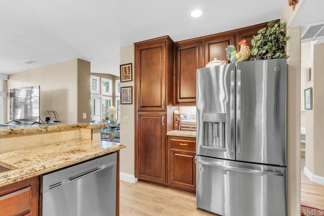 1873 Key Largo Rd, Vista, CA 92081 - kitchen with stainless steel appliances, light stone countertops, light wood finished floors, baseboards, and recessed lighting