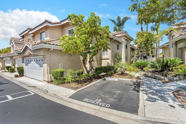 1873 Key Largo Rd, Vista, CA 92081 - view of front of property featuring stucco siding, a tiled roof, and uncovered parking