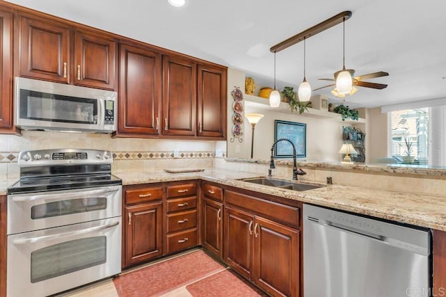 1873 Key Largo Rd, Vista, CA 92081 - kitchen with stainless steel appliances, a sink, light stone counters, ceiling fan, and recessed lighting