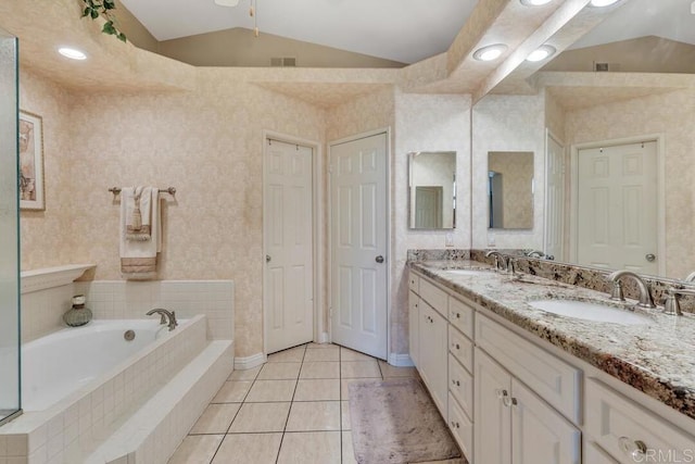1873 Key Largo Rd, Vista, CA 92081 - full bathroom featuring double vanity, a bath, tile patterned flooring, vaulted ceiling, and a closet