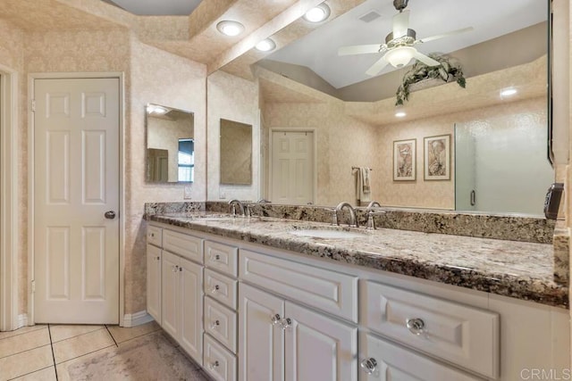 1873 Key Largo Rd, Vista, CA 92081 - bathroom featuring double vanity, vaulted ceiling, ceiling fan, and tile patterned floors