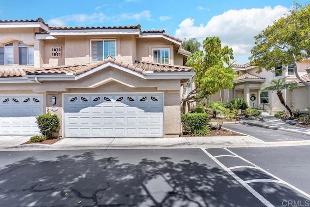 1873 Key Largo Rd, Vista, CA 92081 - view of property with an attached garage, stucco siding, and a tile roof