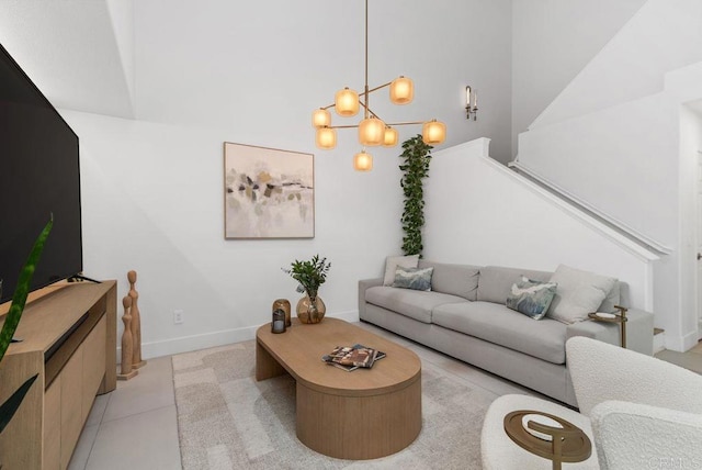 16863 Abundante St, San Diego, CA 92127 - living room featuring a chandelier, light tile patterned floors, and baseboards