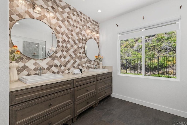 16863 Abundante St, San Diego, CA 92127 - full bathroom with baseboards, double vanity, a tile shower, decorative backsplash, and recessed lighting