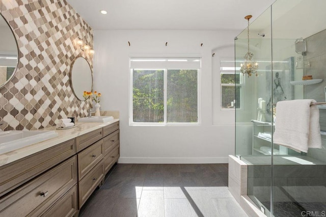 16863 Abundante St, San Diego, CA 92127 - bathroom featuring double vanity, baseboards, a shower stall, a chandelier, and wood finished floors