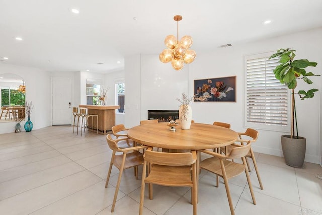 16863 Abundante St, San Diego, CA 92127 - dining area featuring light tile patterned floors, plenty of natural light, recessed lighting, a chandelier, and arched walkways