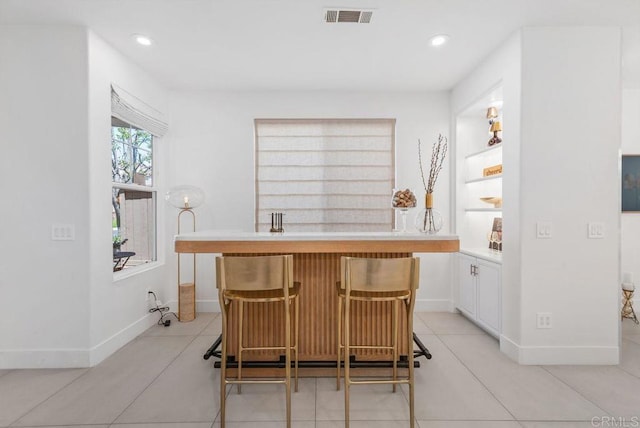 16863 Abundante St, San Diego, CA 92127 - bar area featuring baseboards, recessed lighting, and light tile patterned floors